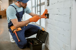 male-electrician-fixing-electrical-wall-socket-wit-2023-11-27-05-23-22-utc2.jpg